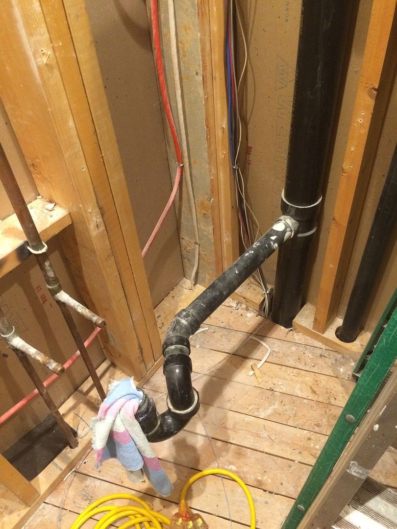 relocate drain around a corner from the stack